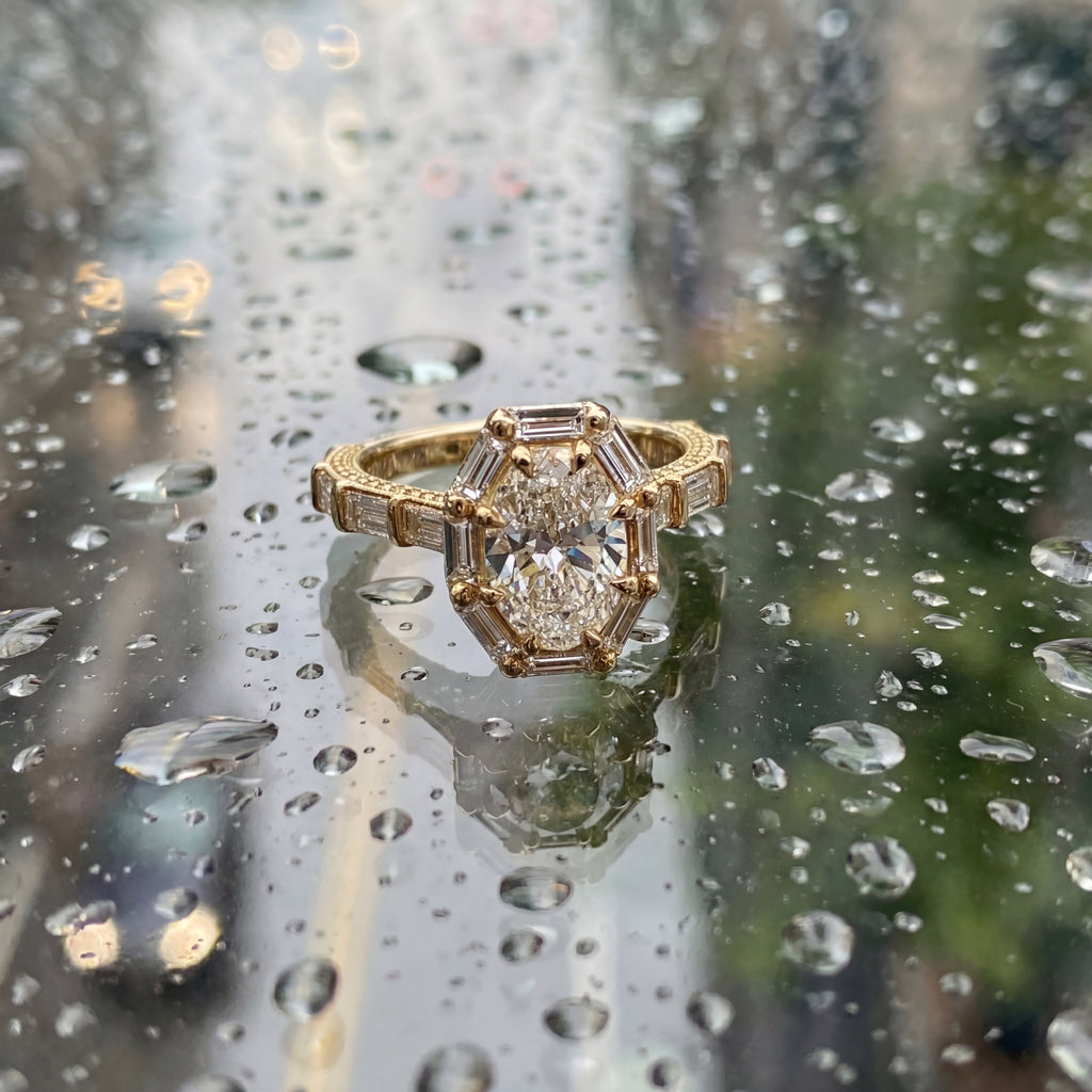 Oval Brilliant and Baguette Diamond Vintage-Inspired Halo Ring in Yellow Gold
